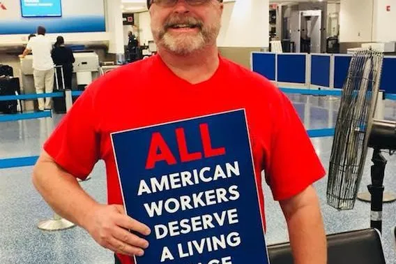 envoy-mia-dec_13-living_wage_sign.jpg